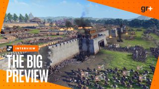 An army attacks a fortified wall with a smoking breach in Total War: Three Kingdoms