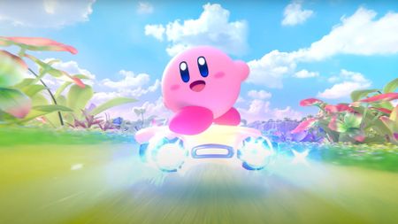 A screenshot from the Kirby Air Riders reveal trailer, showing Kirby waving to the camera.