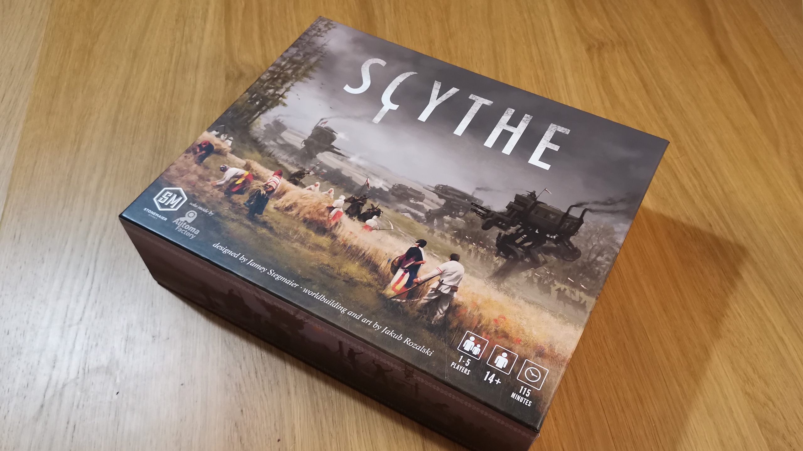Scythe box on a wooden surface, slightly off to one side